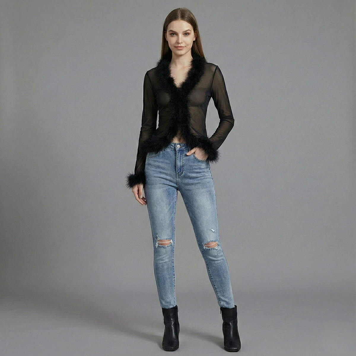 Black mesh long sleeve top with faux fur collar and exposed midriff, fitted silhouette on model