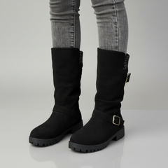 Black buckle boot with knit cuff detail, ankle-wrap silhouette, durable leather construction