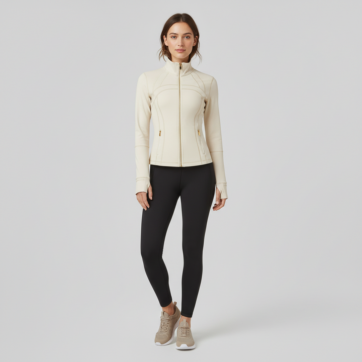 Woman in fitted quick-dry jacket with thumb holes, full zip closure, lightweight construction for layering