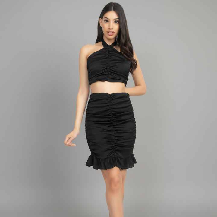 Lavender halter crop top and ruched mini skirt set with double-lined construction, styled on model in natural light