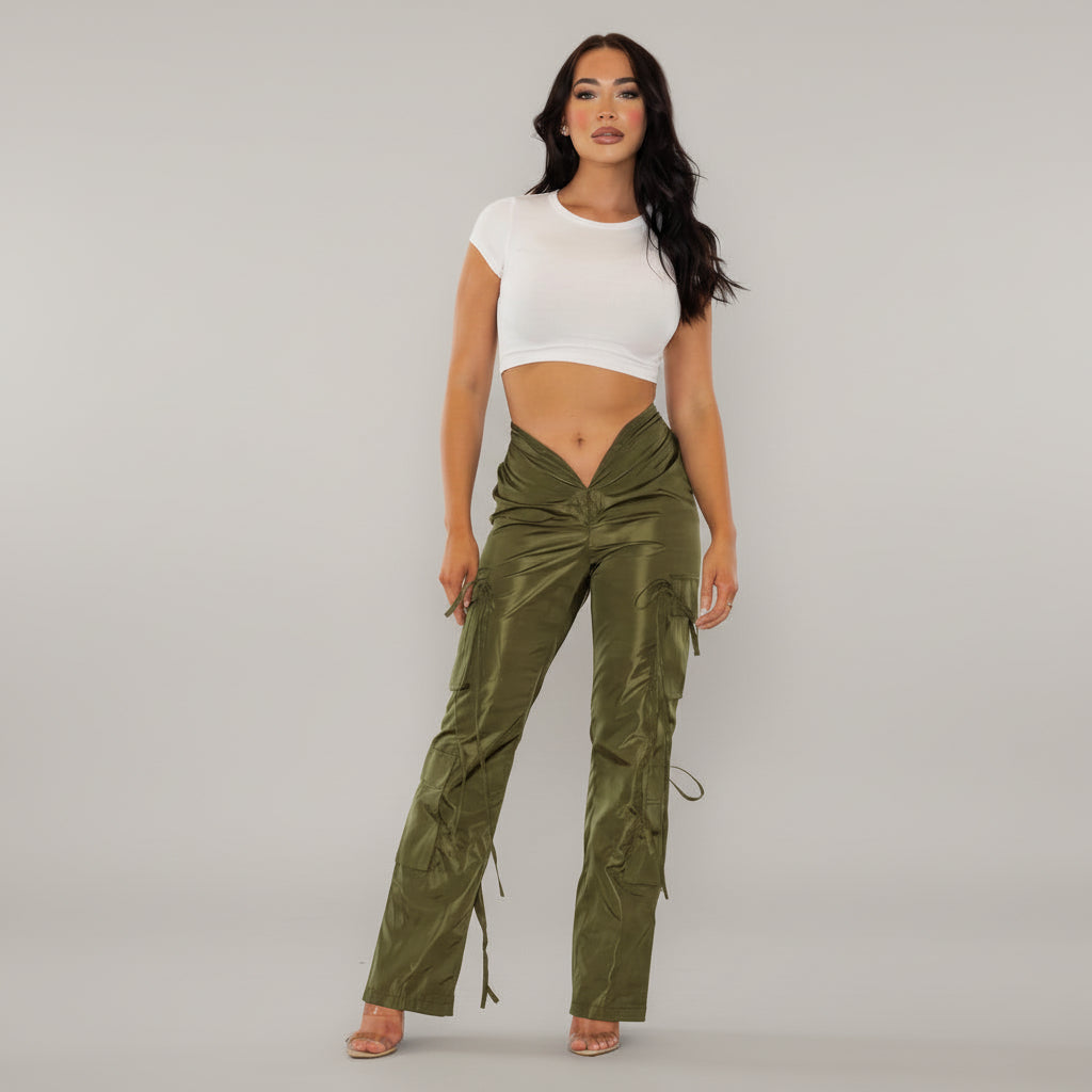 Olive wide-leg cargo pants with V-shaped waistline and functional side pockets on model in urban setting