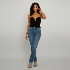 Model wearing beige strapless knit tube top with contoured fit and refined front detail