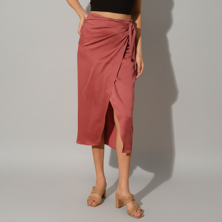 Rust satin crepe midi skirt with side wrap tie detail, styled on model in natural light