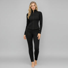 Woman in chocolate brown zip-up jacket and high-waisted leggings, contoured silhouette, full-length studio shot