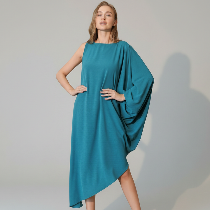 Black asymmetric one-sleeve dress in matte crepe fabric, structured silhouette, minimal design