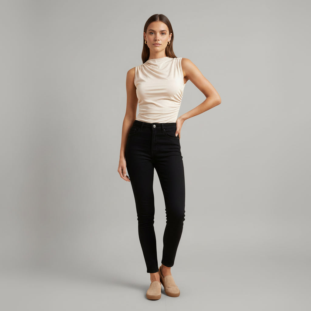 Woman in black high neck crinkled knit top, slim fit silhouette, ribbed texture detail, sleeveless design