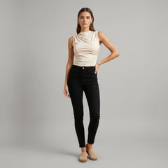 Woman in black high neck crinkled knit top, slim fit silhouette, ribbed texture detail, sleeveless design