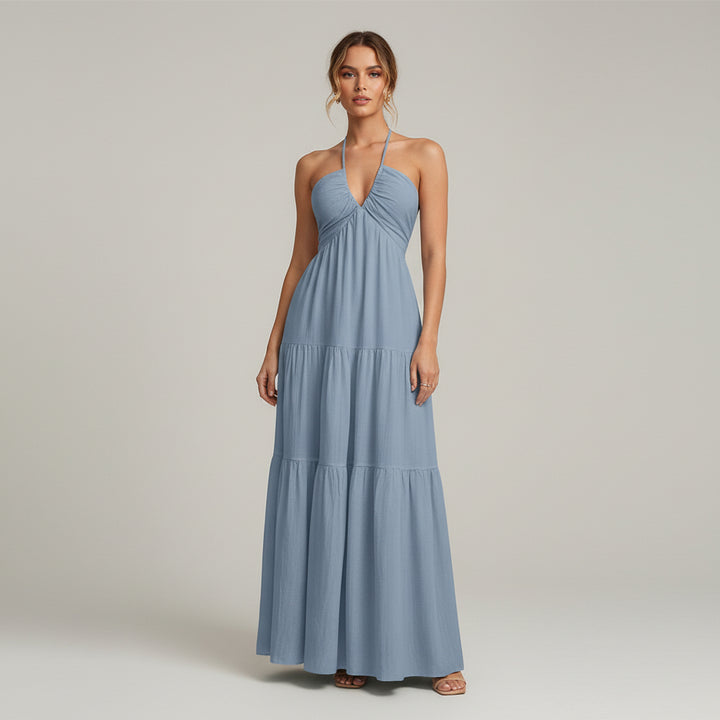 Woman in white A-line dress with ruffled hem and medium stretch fabric, minimalist silhouette