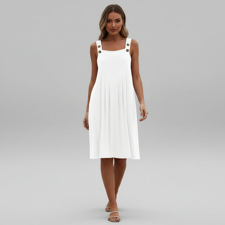 Woman in flowy black overalls maxi dress with wide-leg silhouette and adjustable straps, lightweight drape fabric