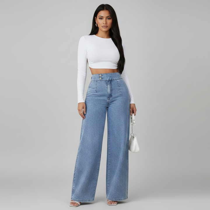 Woman in high-rise wide leg jeans with structured waistband and full-width silhouette in premium denim