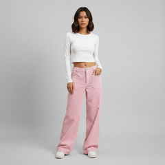 Woman in beige wide leg trousers with elasticated waist, full-length flowing silhouette, neutral tones