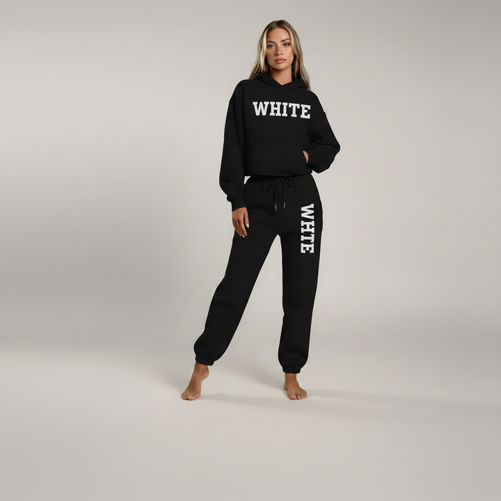 Woman wearing gray StreetSoft hoodie and drawstring pants set in soft polyester, relaxed fit silhouette