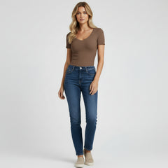 Woman in soft white V-neck tee with relaxed fit, lightweight cotton fabric, casual urban styling