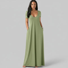 Woman wearing relaxed fit short sleeve tee dress in neutral tone with side pockets, soft cotton construction