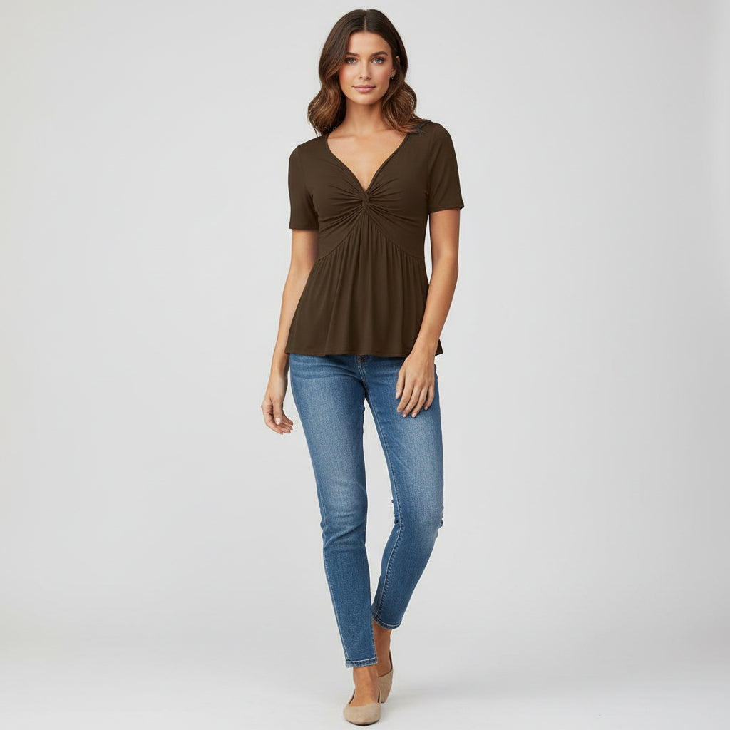 Woman wearing black fitted V-neck tee with twist-front detail in knitted polyester fabric
