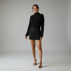 Woman in black ribbed turtleneck dress, body-contouring knit silhouette, long sleeves, full-length fit