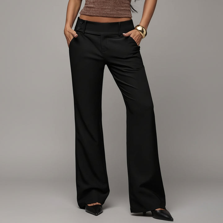 Black high-waist flared trousers with tailored seams, worn with white top in natural light