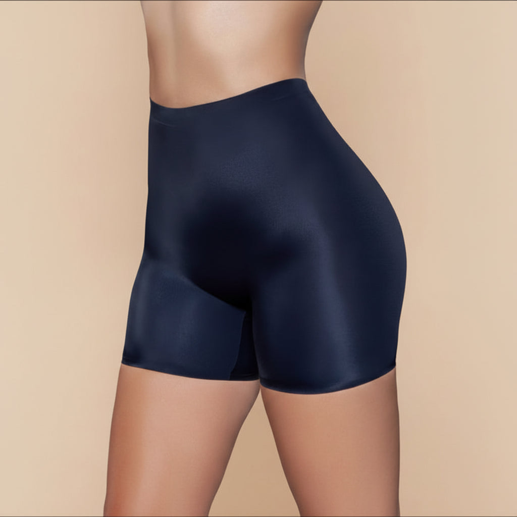 Black high-waisted shapewear shorts with seamless construction and body-contouring polyamide blend fit