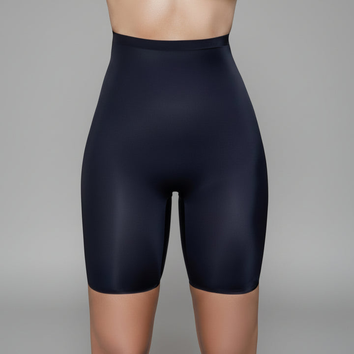 Black high-waist shapewear shorts with seamless construction and mid-thigh length on neutral background
