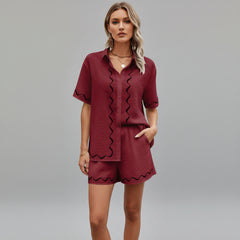 Woman wearing relaxed button-down two-piece set in soft linen fabric, casual silhouette