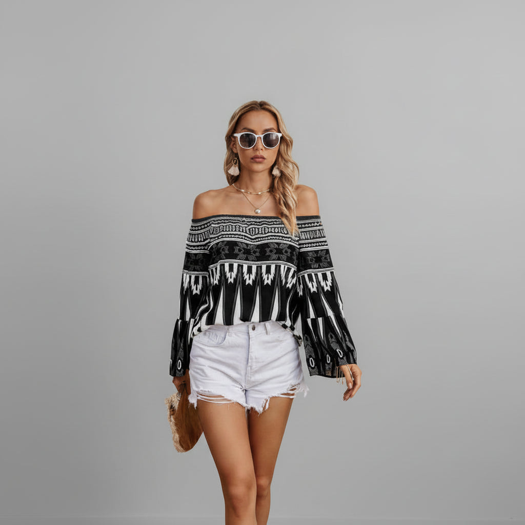 Black off-shoulder top with butterfly flutter sleeves and color-block graphic print on model