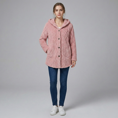 Woman wearing fitted knit hoodie jacket in neutral tone, textured woven polyester, urban setting