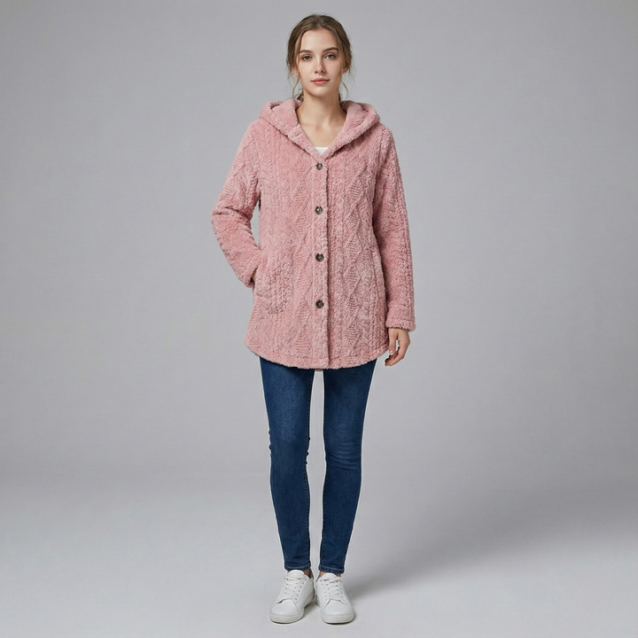 Woman wearing fitted knit hoodie jacket in neutral tone, textured woven polyester, urban setting