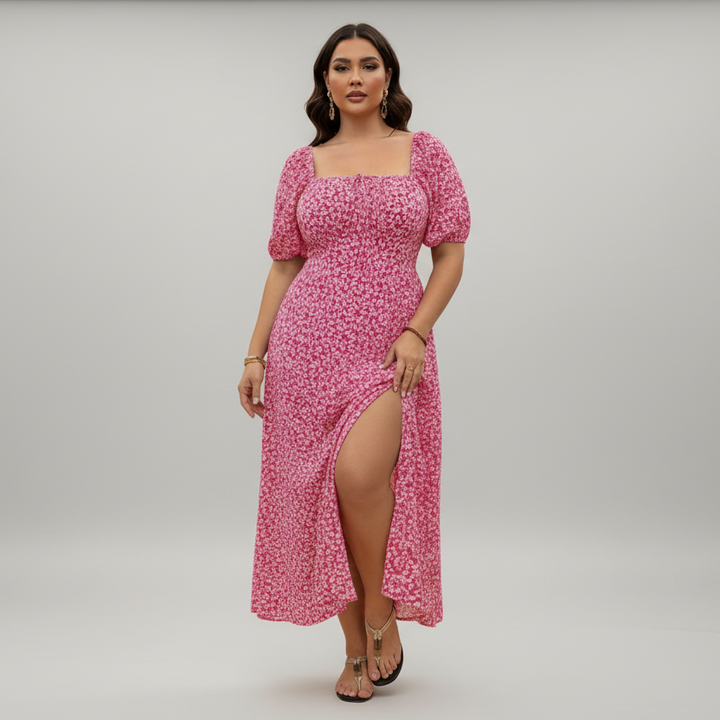 Woman in flowing ditsy floral maxi dress, lightweight fabric, relaxed silhouette, plus-size fit