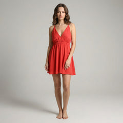 Woman in fuchsia satin crepe skater dress with cami straps, flowy A-line silhouette, soft drape catching natural light
